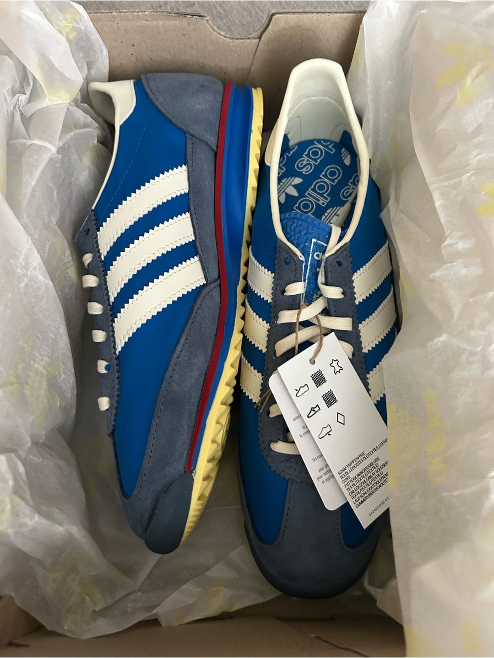 adidas women’s Blue and White Retro Runner Sneakers with Yellow Outsole